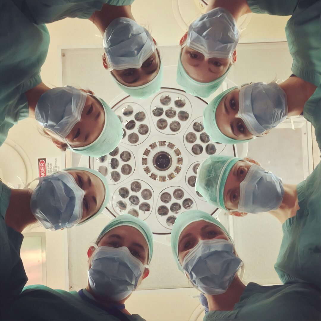Looking up at Doctors in a hospital room from the patient's perspective
